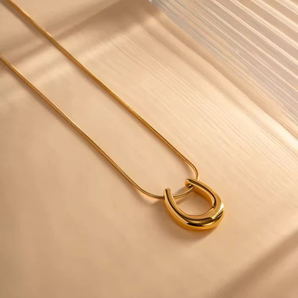 Abstract U golden pendant