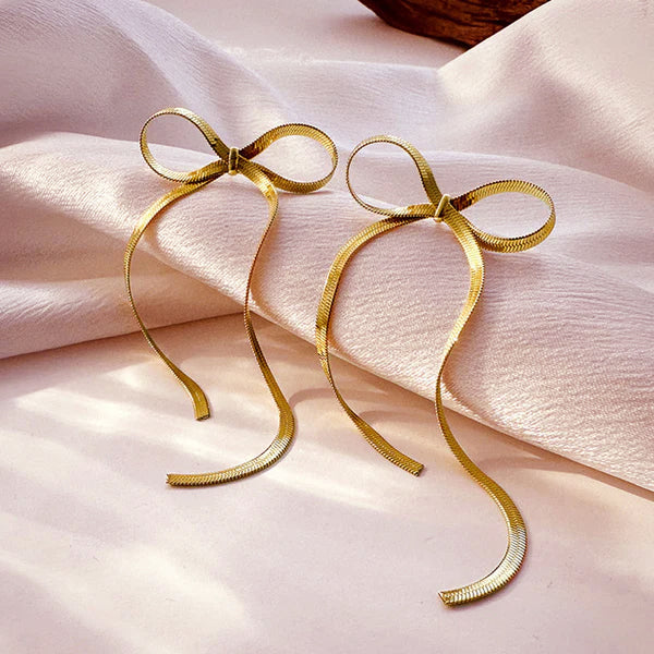 Long bow golden earrings