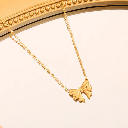 Cute golden bow pendant