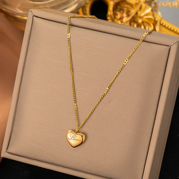 Heart golden pendant with love engraved