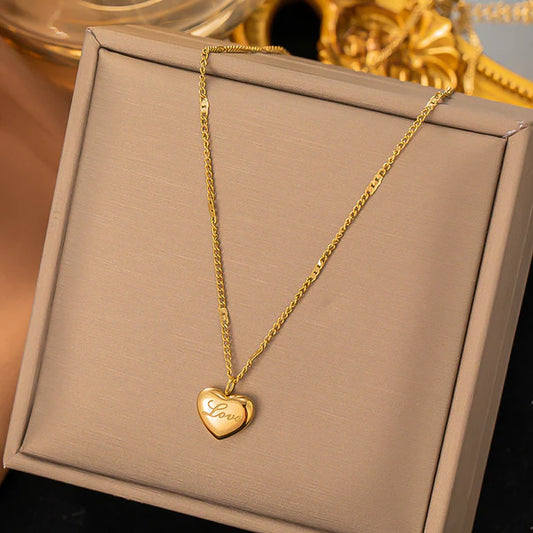 Heart golden pendant with love engraved
