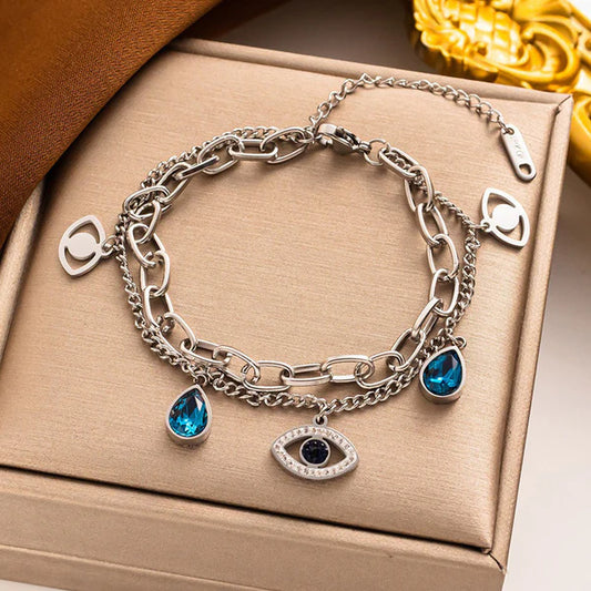 silver platted blue diamond bracelet with eye charm