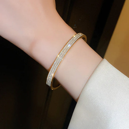 Golden Streak – Stainless Steel Gold Plated Triple Lines American Diamond Contemporary Anti Tarnish Bracelet For Women